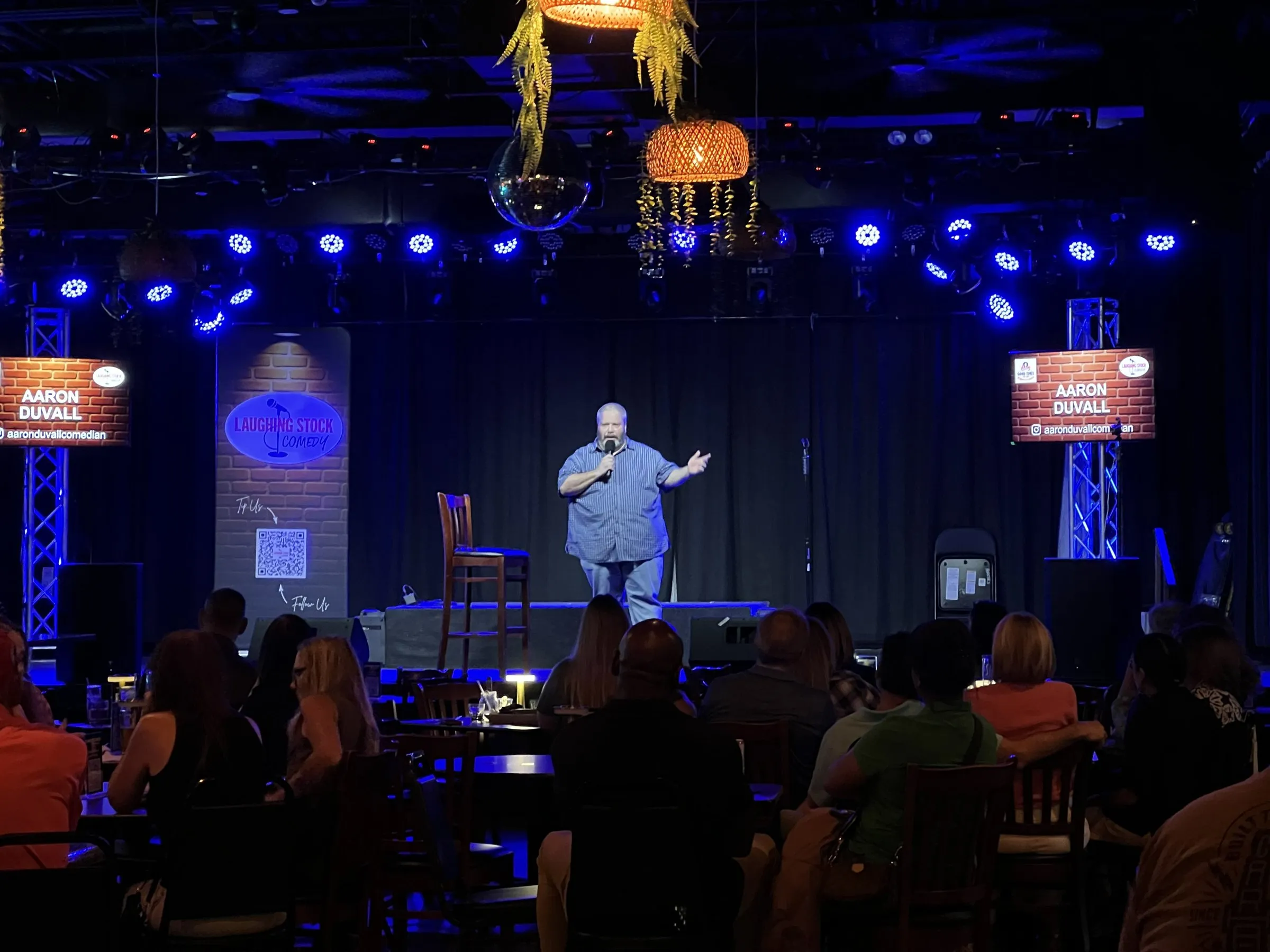 A comic on stage at Good Times Bar & Grill